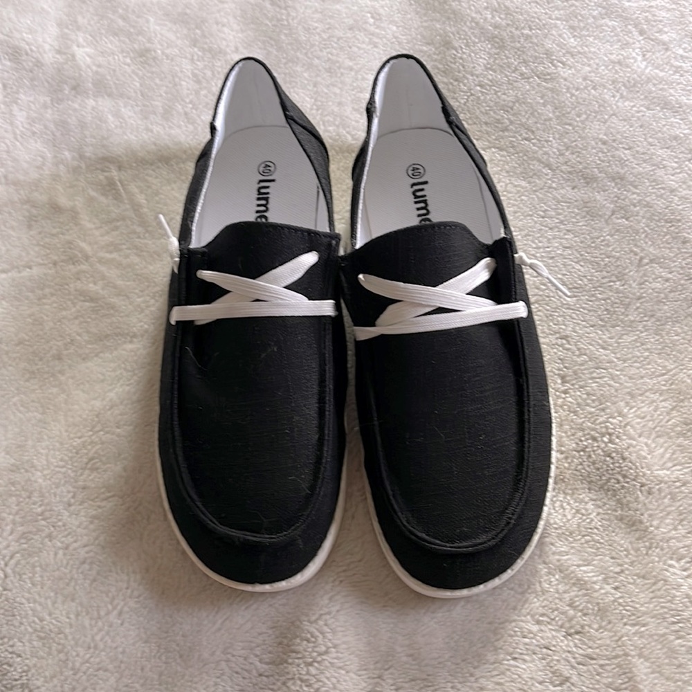 Black slip on boat shoes